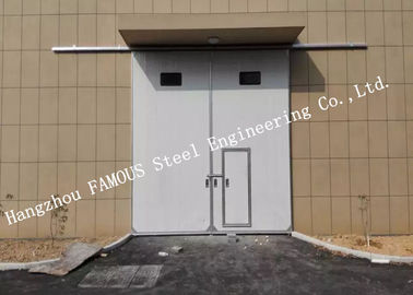 Китай Секционные горизонтальные сползая промышленные двери гаража с дверью доступа пешеходной для мастерской поставщик